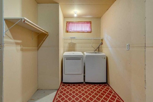 159 Woodbend Way, Okotoks, AB - Indoor Photo Showing Laundry Room