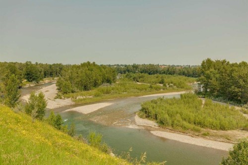 159 Woodbend Way, Okotoks, AB - Outdoor With Body Of Water With View