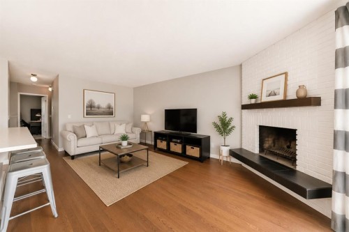 5233 17 Avenue Nw, Calgary, AB - Indoor Photo Showing Living Room With Fireplace