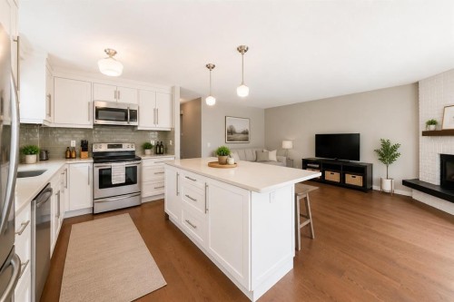 5233 17 Avenue Nw, Calgary, AB - Indoor Photo Showing Kitchen With Fireplace With Stainless Steel Kitchen With Upgraded Kitchen