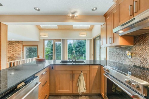 9144 Oakmount Drive Sw, Calgary, AB - Indoor Photo Showing Kitchen With Double Sink