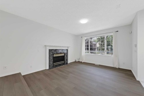 2622 24A Street Sw, Calgary, AB - Indoor Photo Showing Living Room With Fireplace
