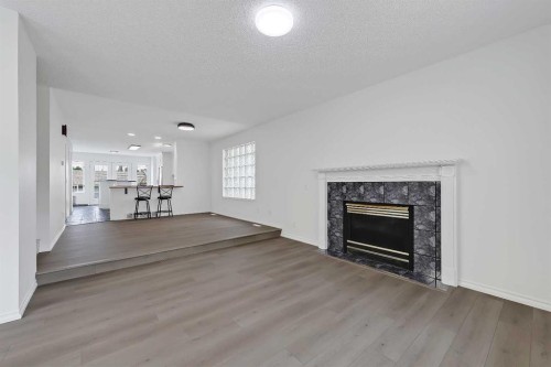 2622 24A Street Sw, Calgary, AB - Indoor Photo Showing Living Room With Fireplace