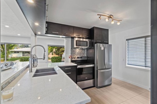 38 Westwood Drive Sw, Calgary, AB - Indoor Photo Showing Kitchen With Stainless Steel Kitchen With Double Sink With Upgraded Kitchen