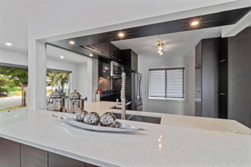 38 Westwood Drive Sw, Calgary, AB - Indoor Photo Showing Kitchen With Double Sink