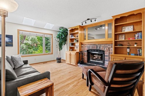 626 Hawkhill Place Nw, Calgary, AB - Indoor Photo Showing Living Room With Fireplace