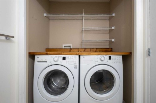 78 Cougar Plateau Way Sw, Calgary, AB - Indoor Photo Showing Laundry Room