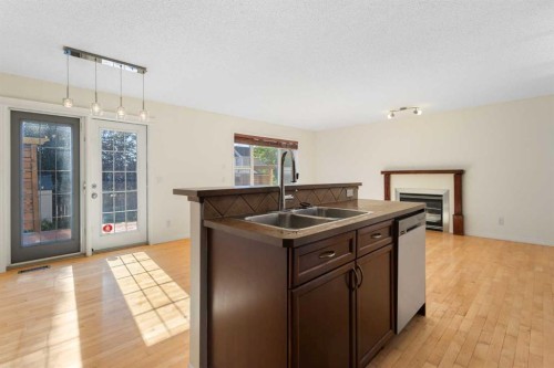 78 Cougar Plateau Way Sw, Calgary, AB - Indoor Photo Showing Kitchen With Double Sink