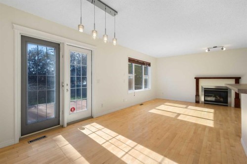 78 Cougar Plateau Way Sw, Calgary, AB - Indoor With Fireplace