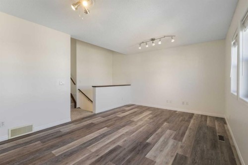 78 Cougar Plateau Way Sw, Calgary, AB - Indoor Photo Showing Other Room
