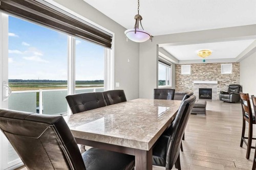 247 Cityscape Way Ne, Calgary, AB - Indoor Photo Showing Dining Room With Fireplace