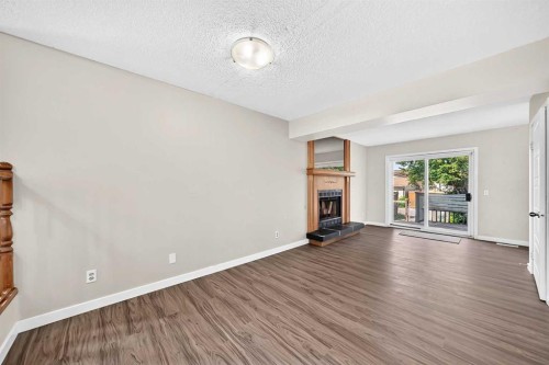 37 Martingrove Way Ne, Calgary, AB - Indoor Photo Showing Living Room With Fireplace