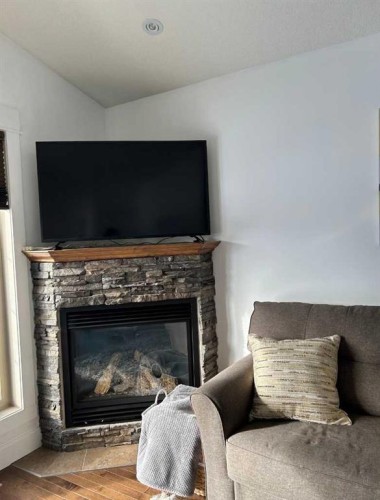 1319 54 Avenue Close, Lloydminster, AB - Indoor Photo Showing Living Room With Fireplace