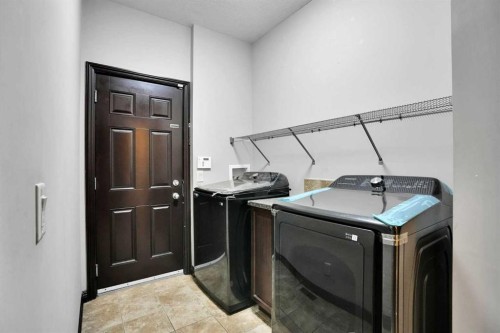 212 Everbrook Way Sw, Calgary, AB - Indoor Photo Showing Laundry Room