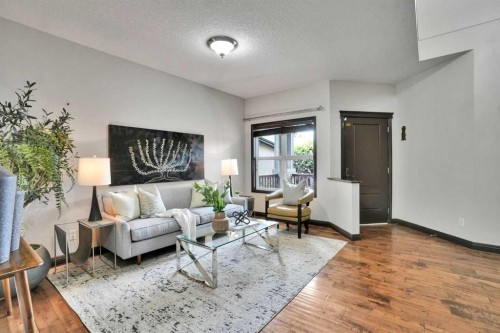 212 Everbrook Way Sw, Calgary, AB - Indoor Photo Showing Living Room