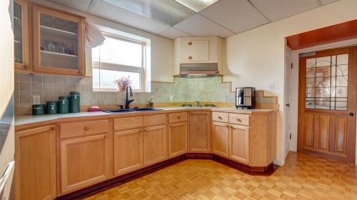 335 50 Avenue West, Claresholm, AB - Indoor Photo Showing Kitchen With Double Sink