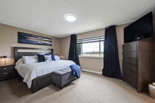 46 Spring View Sw, Calgary, AB - Indoor Photo Showing Bedroom