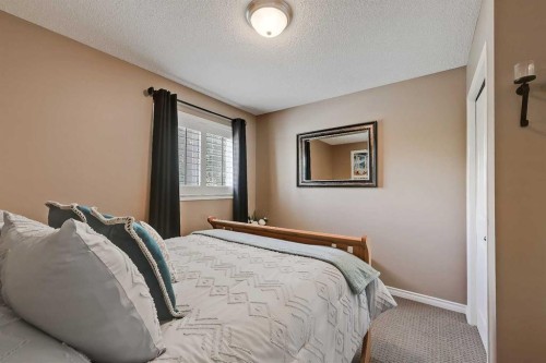 46 Spring View Sw, Calgary, AB - Indoor Photo Showing Bedroom