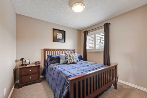 46 Spring View Sw, Calgary, AB - Indoor Photo Showing Bedroom