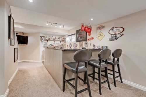 46 Spring View Sw, Calgary, AB - Indoor Photo Showing Other Room