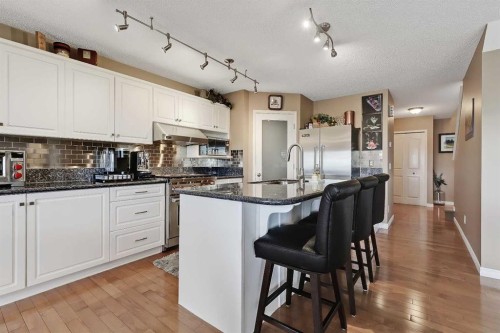 46 Spring View Sw, Calgary, AB - Indoor Photo Showing Kitchen With Upgraded Kitchen