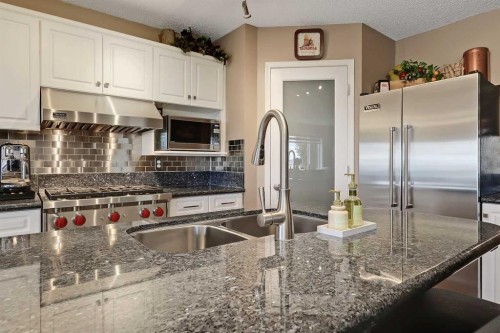 46 Spring View Sw, Calgary, AB - Indoor Photo Showing Kitchen With Double Sink With Upgraded Kitchen