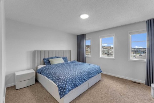 97 Corner Glen Way Ne, Calgary, AB - Indoor Photo Showing Bedroom