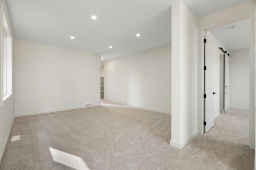 112 Sunrise Heath, Cochrane, AB - Indoor Photo Showing Other Room
