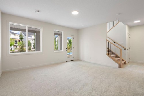 112 Sunrise Heath, Cochrane, AB - Indoor Photo Showing Other Room