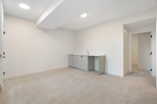 112 Sunrise Heath, Cochrane, AB - Indoor Photo Showing Other Room