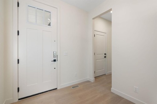 112 Sunrise Heath, Cochrane, AB - Indoor Photo Showing Other Room