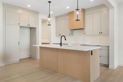 112 Sunrise Heath, Cochrane, AB - Indoor Photo Showing Kitchen