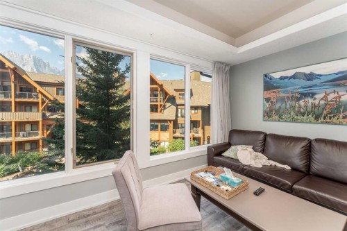 213-173 Kananaskis Way, Canmore, AB - Indoor Photo Showing Living Room