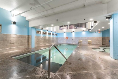 213-173 Kananaskis Way, Canmore, AB - Indoor Photo Showing Other Room With In Ground Pool