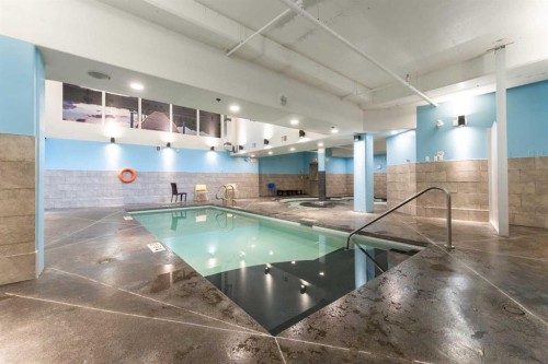 213-173 Kananaskis Way, Canmore, AB - Indoor Photo Showing Other Room With In Ground Pool