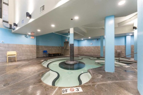 213-173 Kananaskis Way, Canmore, AB - Indoor Photo Showing Other Room With In Ground Pool