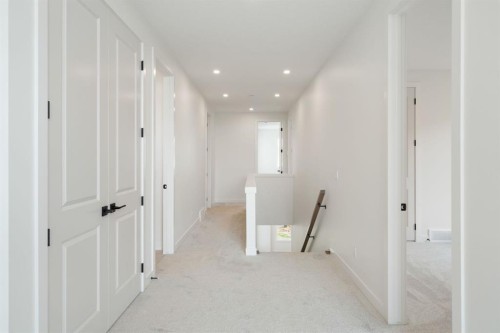 116 Sunrise Heath, Cochrane, AB - Indoor Photo Showing Other Room