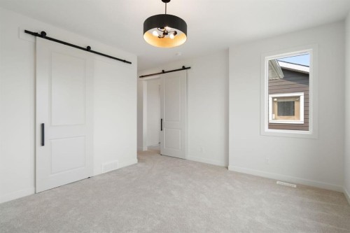 116 Sunrise Heath, Cochrane, AB - Indoor Photo Showing Other Room