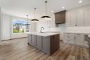 116 Sunrise Heath, Cochrane, AB  - Indoor Photo Showing Kitchen With Upgraded Kitchen 