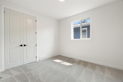 116 Sunrise Heath, Cochrane, AB - Indoor Photo Showing Other Room
