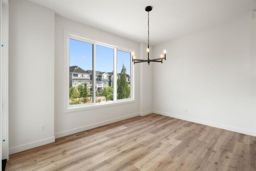 116 Sunrise Heath, Cochrane, AB - Indoor Photo Showing Other Room