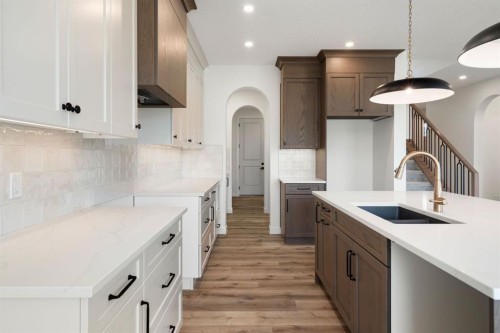 116 Sunrise Heath, Cochrane, AB - Indoor Photo Showing Kitchen With Upgraded Kitchen