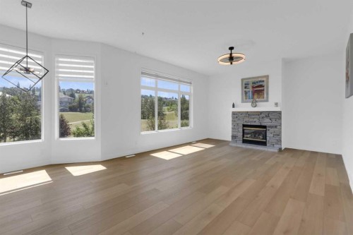 99 Edgeridge View Nw, Calgary, AB - Indoor Photo Showing Living Room With Fireplace