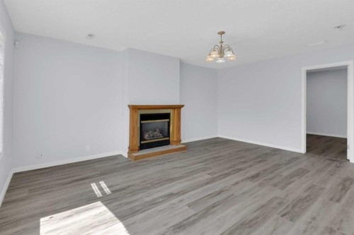 99 Edgeridge View Nw, Calgary, AB - Indoor Photo Showing Living Room With Fireplace