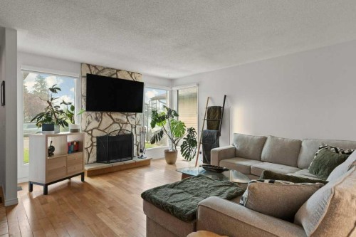 167 Deerpath Court Se, Calgary, AB - Indoor Photo Showing Living Room With Fireplace