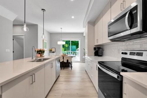 426 Shawnee Square Sw, Calgary, AB - Indoor Photo Showing Kitchen With Double Sink