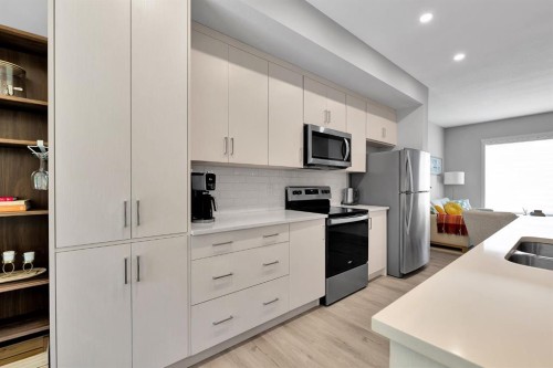 426 Shawnee Square Sw, Calgary, AB - Indoor Photo Showing Kitchen With Stainless Steel Kitchen With Double Sink
