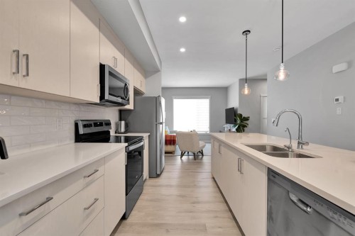 426 Shawnee Square Sw, Calgary, AB - Indoor Photo Showing Kitchen With Double Sink With Upgraded Kitchen