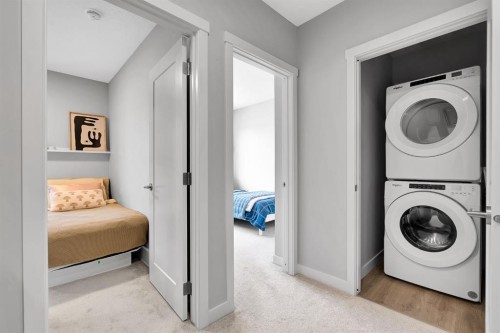 426 Shawnee Square Sw, Calgary, AB - Indoor Photo Showing Laundry Room