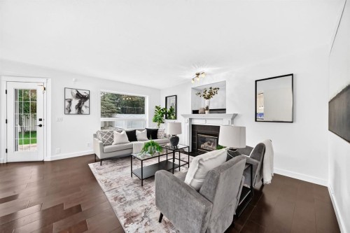 262 Coventry Court Ne, Calgary, AB - Indoor Photo Showing Living Room With Fireplace